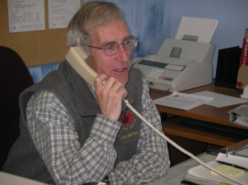 Image of a Community Policing volunteer on the phone