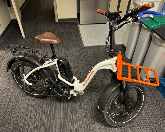 Picture of a white, black and orange Rad Power Mini ST2 E-Bike