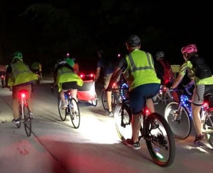 cyclists riding at night with reflective clothing