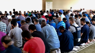 photo of Constable Sahak participating in Eid prayer at a local mosque